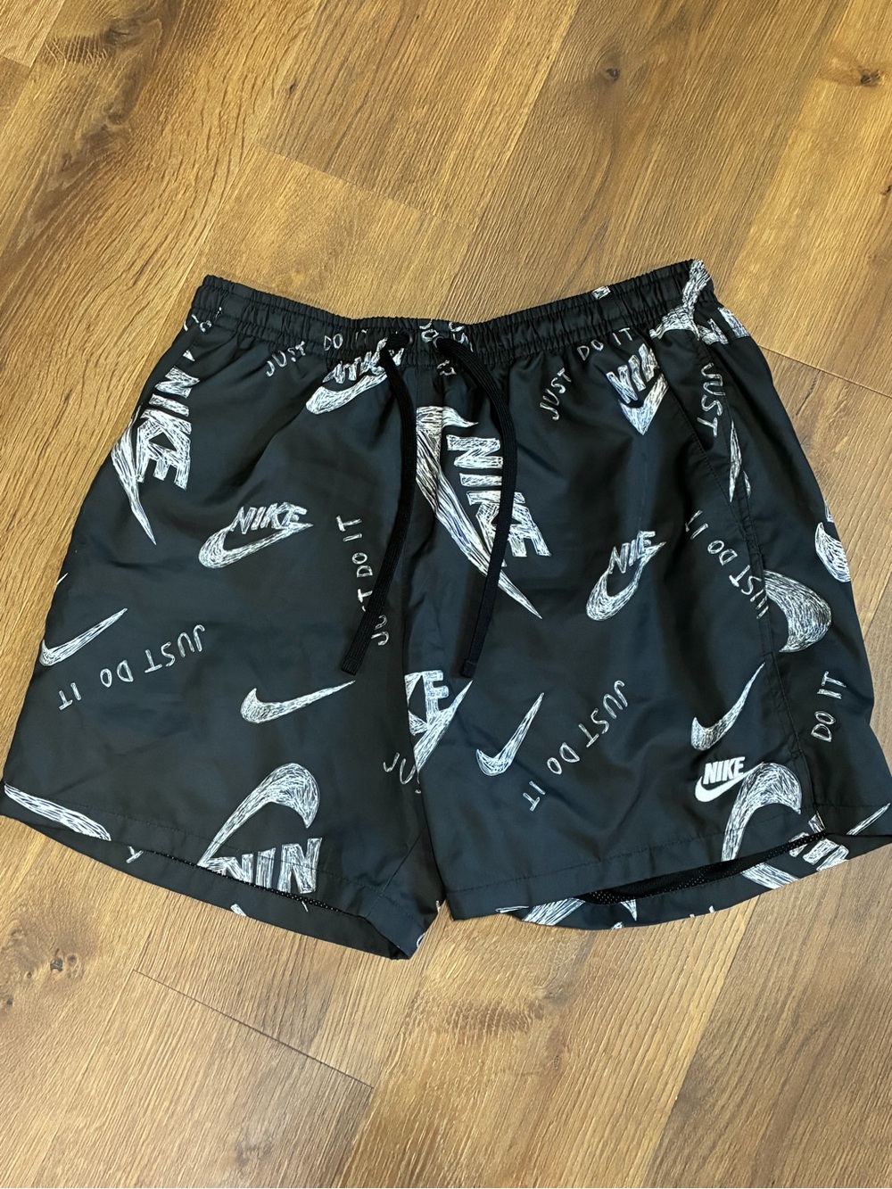 Nike Black Swim Trunks with White Swoosh Print